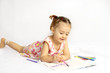The beautiful girl drawing pencils in a sketch pad on the isolat