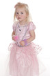 Photo: cute girl in pink princess dress tentatively looking at camera cute girl in pink princess dress tentatively looking at camera