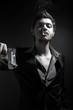 Angry gangster is shouting and pointing a gun