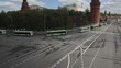 motorcyclists and green buses near the Kremlin