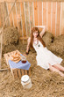 Redhead hippie young woman have breakfast in barn Redhead hippie young woman have breakfast in barn