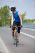 Professional  biker riding on race bike looking behind