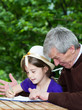 ����: Grandfather spending time with little girl outside � Smailhodzic #32617779