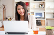 beautiful asian woman using a laptop computer