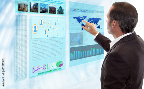 Photo: Businessman works with futuristic Display Businessman works with futuristic Display