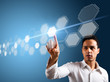 Foto: man touching a virtual interface man touching a virtual interface