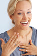 Photo: Closeup of very excited young woman Closeup of very excited young woman