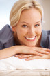 Happy young female relaxed on floor