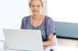 Casual young woman working on laptop