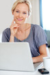 Thoughtful young woman with a laptop