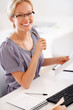 Busy young female executive working at her workplace