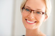 Portrait of happy young lady wearing glasses