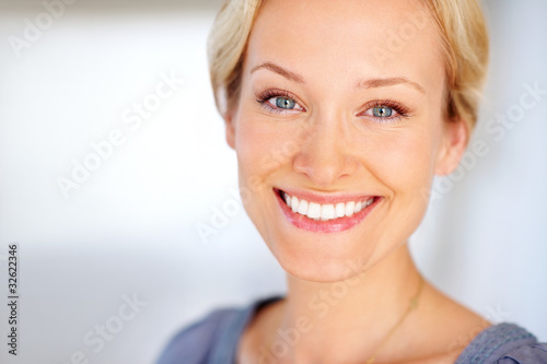 Photo: Portrait of a cute young female smiling Portrait of a cute young female smiling