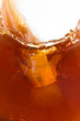 ice cube dropping to soft drink