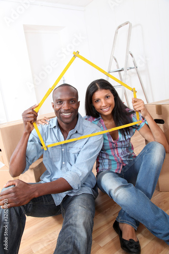 Photo: Young couple buying new home Young couple buying new home