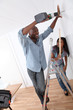 Young couple renovating their new house Young couple renovating their new house