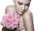 beautiful young sexy woman with flowers on white background
