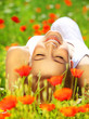 ����: Beautiful female laying on the flower filed � Anna Omelchenko #32631139