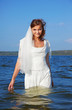 Photo: bride walking in waves bride walking in waves