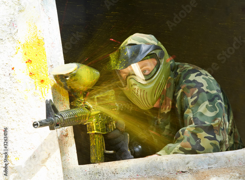 Photo: paintball player under attack paintball player under attack
