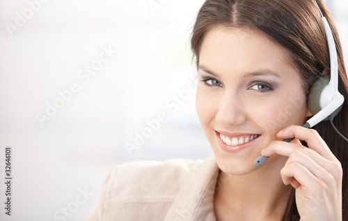 Photo: Happy dispatcher working in call center Happy dispatcher working in call center