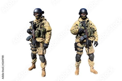 Photo: Soldier with the rifle in camouflage uniform isolated on white Soldier with the rifle in camouflage uniform isolated on white