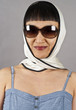 Photo: Asian Woman Wearing Sunglasses and Silk Scarf Asian Woman Wearing Sunglasses and Silk Scarf