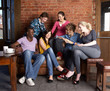 Photo: Young friends in café Young friends in café