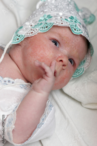 Photo: Newborn sucks his finger Newborn sucks his finger