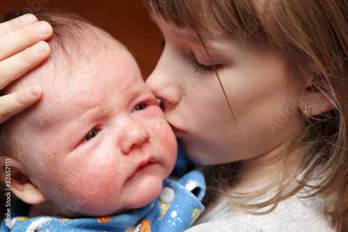 Photo: Sister kisses her brother Sister kisses her brother