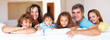 Mature couple with their kids smiling
