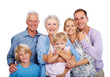 Smiling family standing together against white background