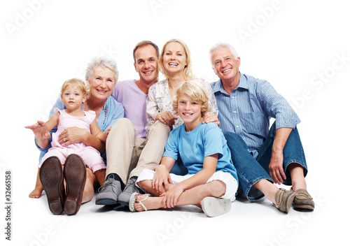 Photo: Happy family sitting together on floor Happy family sitting together on floor