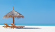 Two chairs and umbrella on the beach