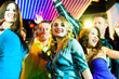 Party people dancing in disco club