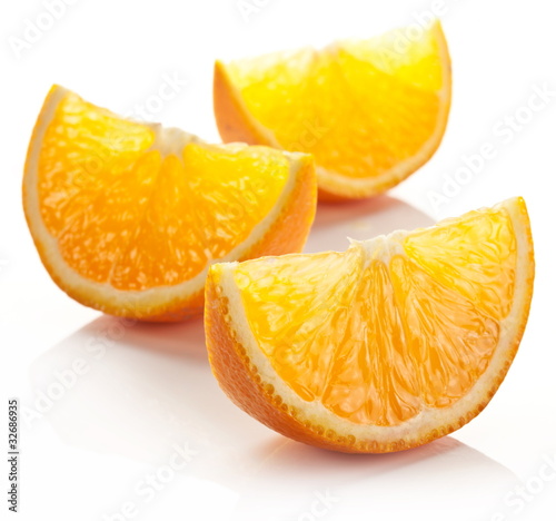 Photo: Orange slice on a white background. Orange slice on a white background.