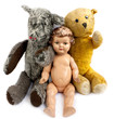 Two teddy bears and a doll on white background