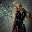 Punk girl with a bat behind broken glass Punk girl with a bat behind broken glass