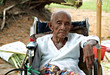 Old invalid woman in the wheelchair