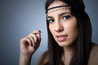 Portrait of beautiful young woman, isolated on grey background
