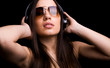 attractive young woman listening to music with headphones