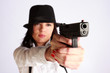 Gangster-girl aiming with the gun Gangster-girl aiming with the gun