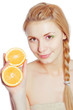 Young woman with oranges in her hands