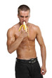 Muscle sexy wet naked young man eating the banana