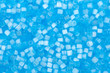 background of blue decorative plastic craft beads background of blue decorative plastic craft beads