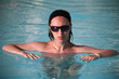 Young beautiful woman in the pool