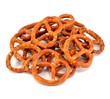 A pile of salted pretzels on a white background