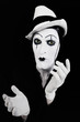 face and hands of mime with dark make-up