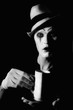mime clown holding white cup