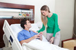 Woman paying a visit to the patient